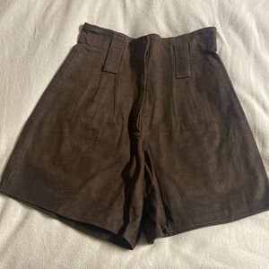 Never worn real suede brown shorts. Not sure of size, believe is size 6